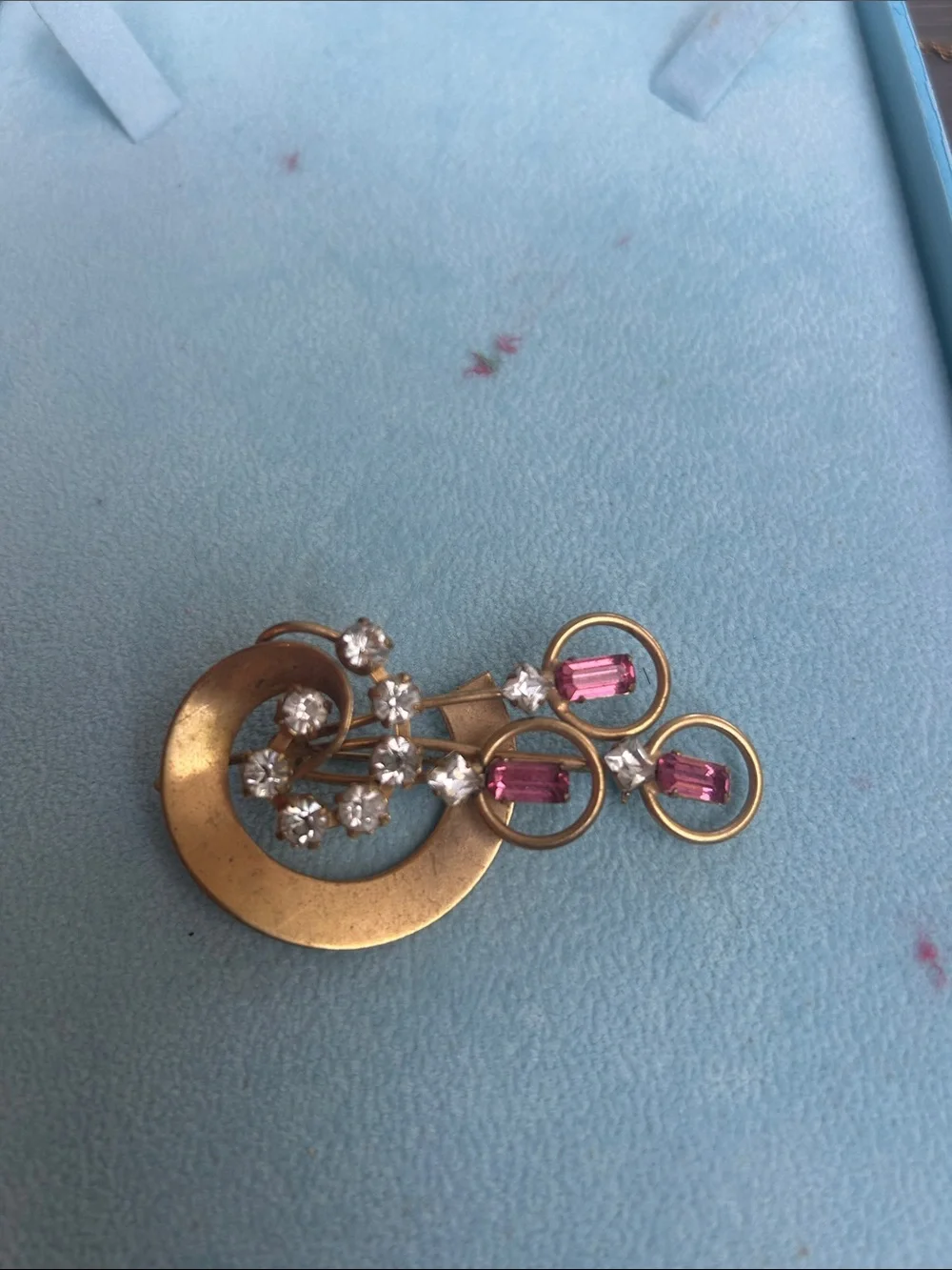 Vintage gold tone brooch with pink and clear rhinestones